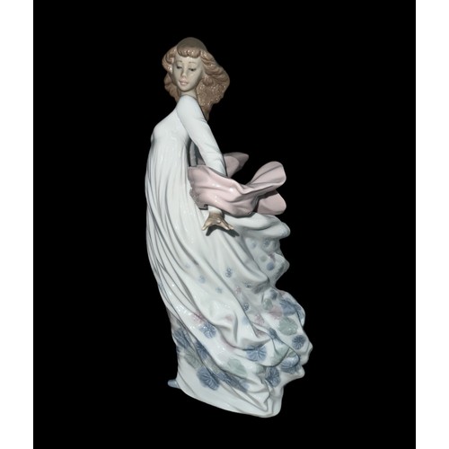 334 - A large Lladro ‘Spring Splendor’ ceramic figurine of a lady holding a floral basket in a flowing dre... 