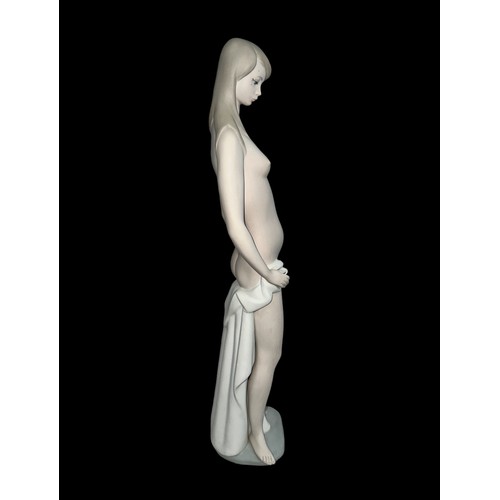 333 - A large Lladro female nude bather figurine with matt glaze finish. Height 46.5cm.