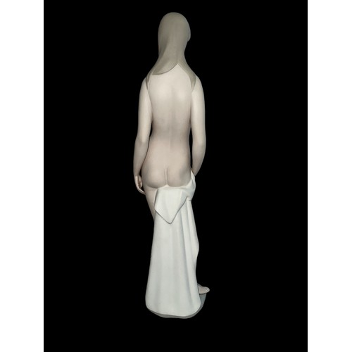 333 - A large Lladro female nude bather figurine with matt glaze finish. Height 46.5cm.