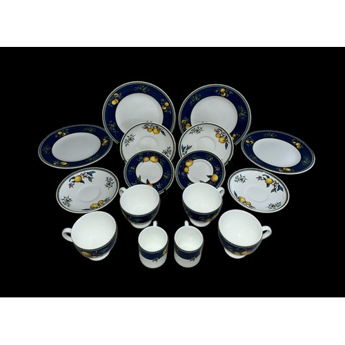 329 - A Wedgwood Bone China Citrons (1993) part service to include; two small coffee cups and saucers, fou... 