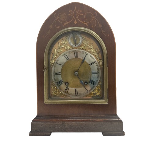 124 - An arch topped mantel clock by the Kemp Brothers of Union St, Bristol. Inlaid mahogany case, silvere... 