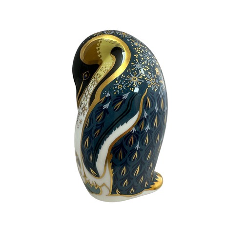 61 - A Royal Crown Derby Penguin and Chick paperweight, with silver stopper, 14cm high.  Boxed - needs re... 