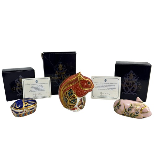 63 - Three Royal Crown Derby paperweights, all boxed. Includes Millennium Bug, with gold stopper and cert... 