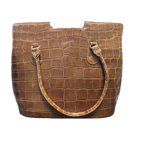 91 - A crocodile skin (possibly faux) handbag with leather interior. Dimensions approx 29cm x 24cm.