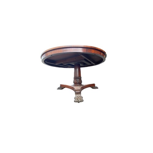 185 - Late Regency William IV rosewood breakfast table with triform base and paw feet. Diameter 130cm.