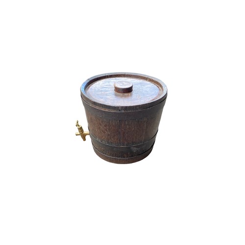 11 - Banded oak barrel with brass tap, height 35cm, diameter 38cm.