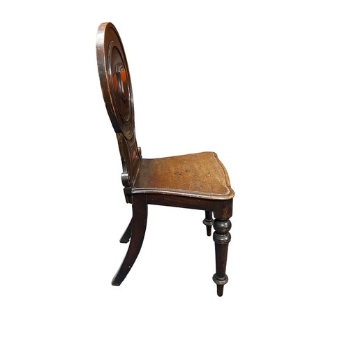 394 - Victorian mahogany shield back hall chair plus two oak rush seat early 20th Century chairs.