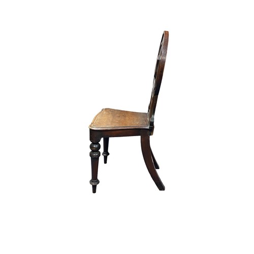 394 - Victorian mahogany shield back hall chair plus two oak rush seat early 20th Century chairs.