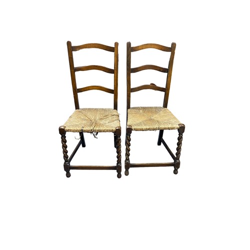 394 - Victorian mahogany shield back hall chair plus two oak rush seat early 20th Century chairs.