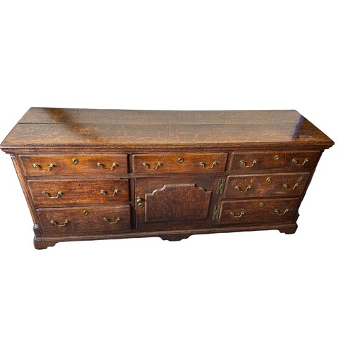 495 - Late 18th Century oak dresser base with central door with raised fielded panel, 7 working draws, ori... 