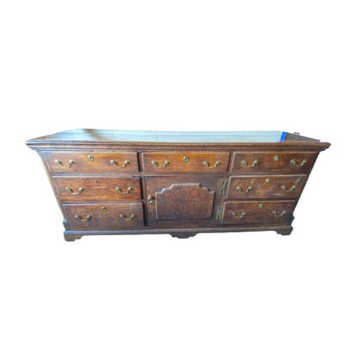 495 - Late 18th Century oak dresser base with central door with raised fielded panel, 7 working draws, ori... 