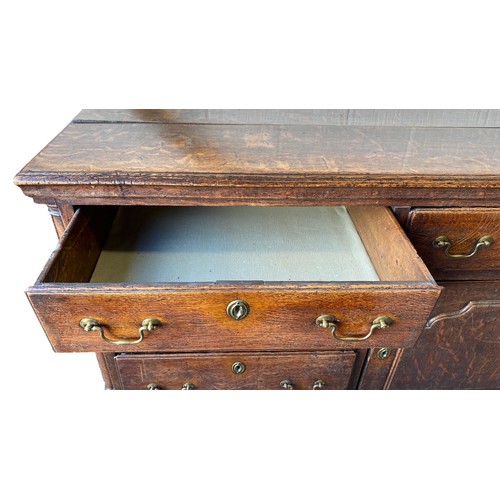 495 - Late 18th Century oak dresser base with central door with raised fielded panel, 7 working draws, ori... 