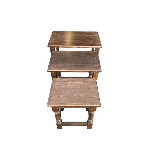 407 - Oak nest of 3 tables, largest measures: height 47cm, width 55cm and depth 35cm.