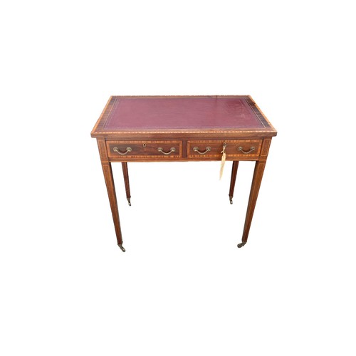 497 - Edwardian mahogany 2 drawer writing table, brass casters, width 76cm, depth 47cm, height 74cm.