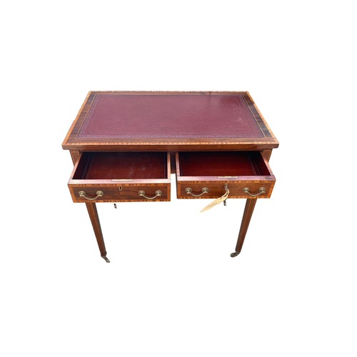 497 - Edwardian mahogany 2 drawer writing table, brass casters, width 76cm, depth 47cm, height 74cm.