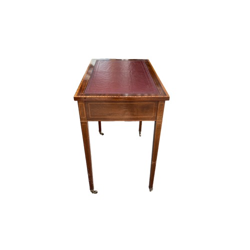 497 - Edwardian mahogany 2 drawer writing table, brass casters, width 76cm, depth 47cm, height 74cm.