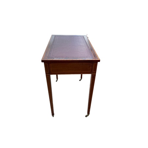 497 - Edwardian mahogany 2 drawer writing table, brass casters, width 76cm, depth 47cm, height 74cm.