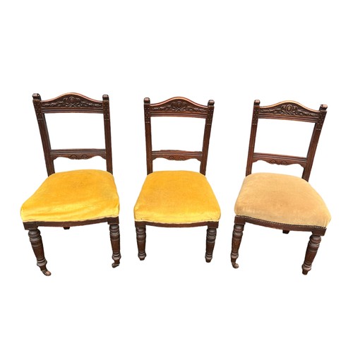 517 - Three Edwardian carved chairs, casters to front legs (missing on one chair), height 94cm, width 48cm... 