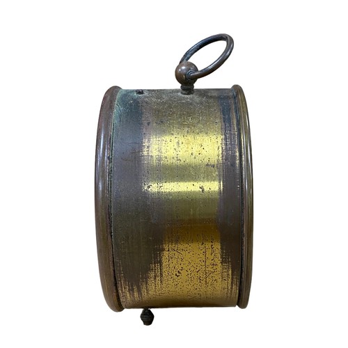 128 - Brass barrel alarm clock, 9.5cm diameter, in working order.