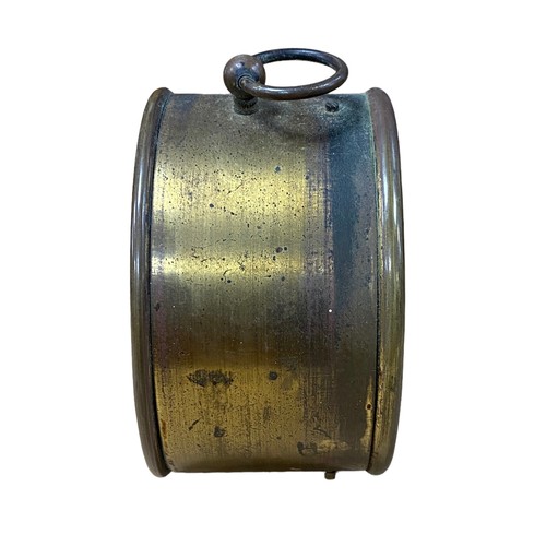 128 - Brass barrel alarm clock, 9.5cm diameter, in working order.