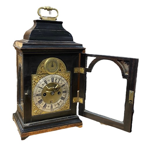 134 - 18th Century ebony veneered bracket clock. The arched brass dial with 'Strike/Silent' dial to the ar... 