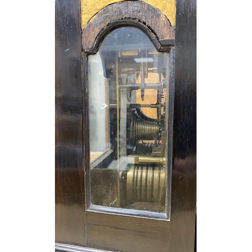 134 - 18th Century ebony veneered bracket clock. The arched brass dial with 'Strike/Silent' dial to the ar... 