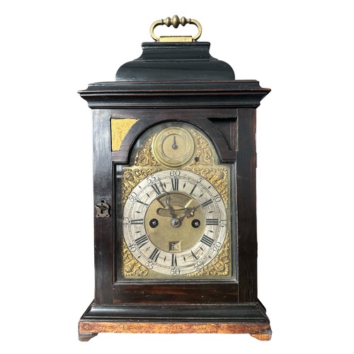 134 - 18th Century ebony veneered bracket clock. The arched brass dial with 'Strike/Silent' dial to the ar... 