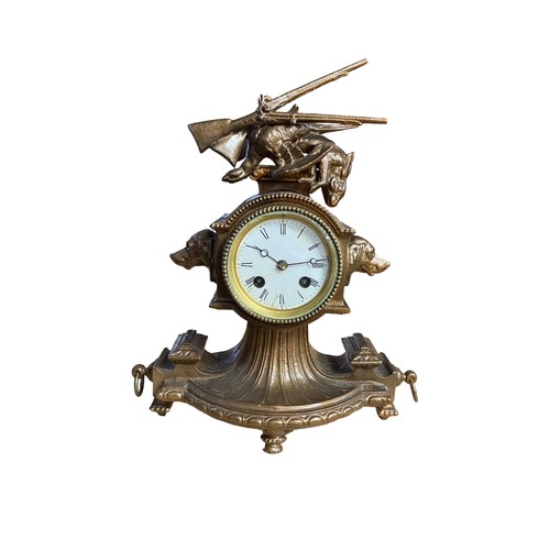 122 - Spelter bell strike mantel clock with hunting theme, hounds heads to left and right of porcelain dia... 