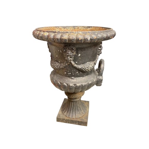 321 - Cast iron fluted tulip shaped garden urn/planter on stand, total height 92cm (stand is 30cm), diamet... 