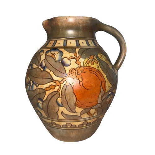 507 - A Bursley Ware Charlotte Rhead design jug. Height 22cm.