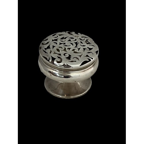 379 - An Edwardian silver pot pourri holder, Birmingham 1909, minor dents, approx 200g. A small silver ves... 