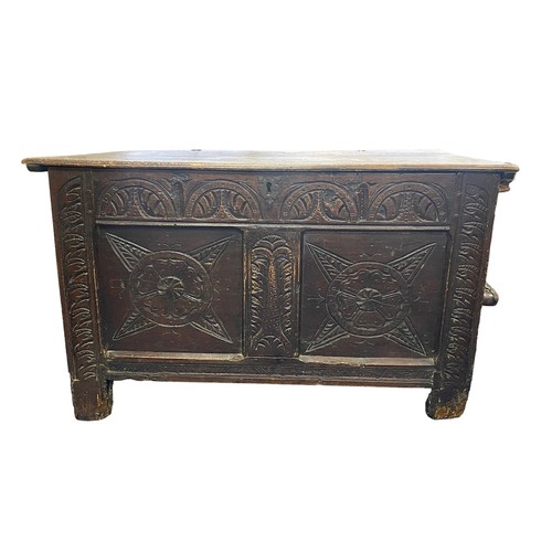 88 - 17th Century elm coffer carved to front and sides, width 92cm, depth 51cm, height 56cm.