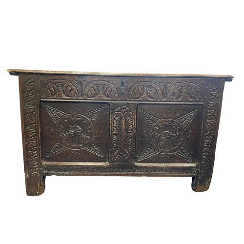 88 - 17th Century elm coffer carved to front and sides, width 92cm, depth 51cm, height 56cm.