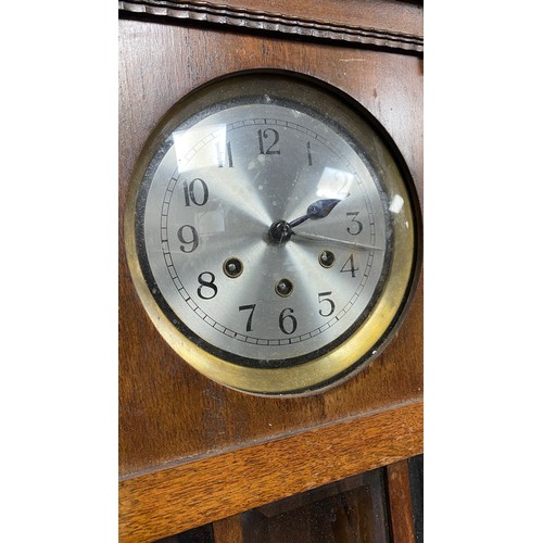 129 - Mahogany cased wall clock with plague 