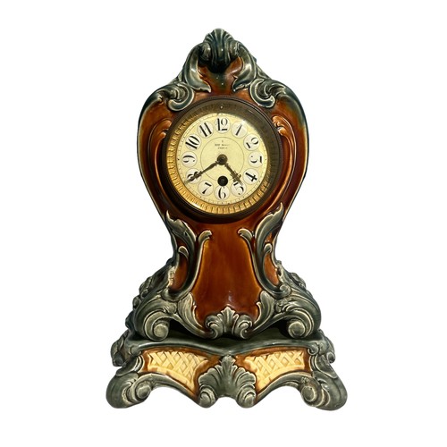 131 - Henry Marc of Paris, A late 19th century French Louis XV style ormolu mounted porcelain mantel clock... 