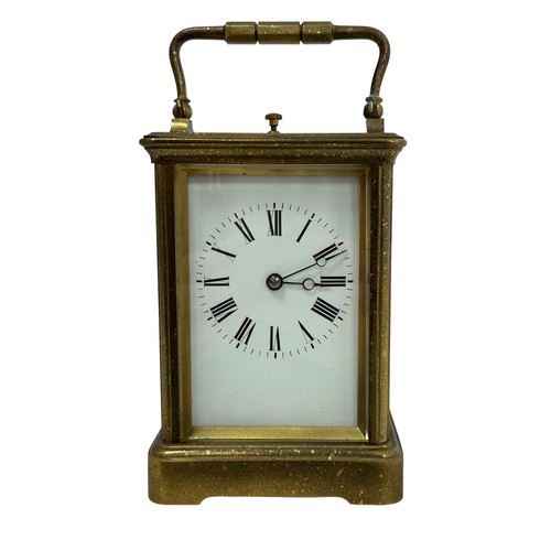 130 - A French repeating carriage clock, circa 1890s.  Housed in a brass case with a white enamel dial and... 