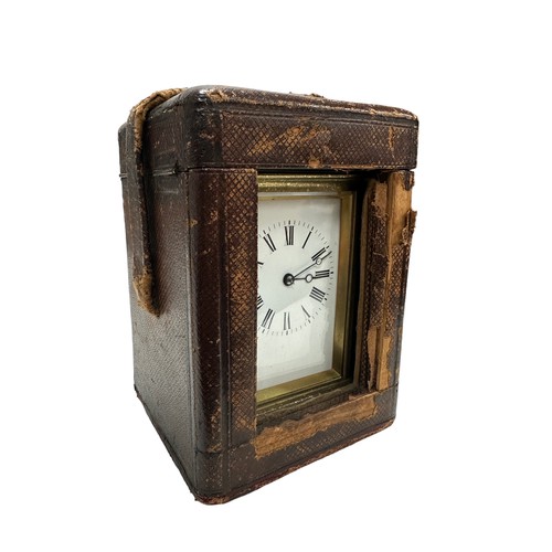 130 - A French repeating carriage clock, circa 1890s.  Housed in a brass case with a white enamel dial and... 