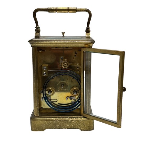 130 - A French repeating carriage clock, circa 1890s.  Housed in a brass case with a white enamel dial and... 