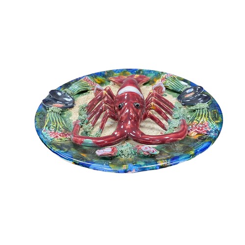 38 - Two Majolica dishes - a crab and a lobster. Approx. 32cm in diameter.