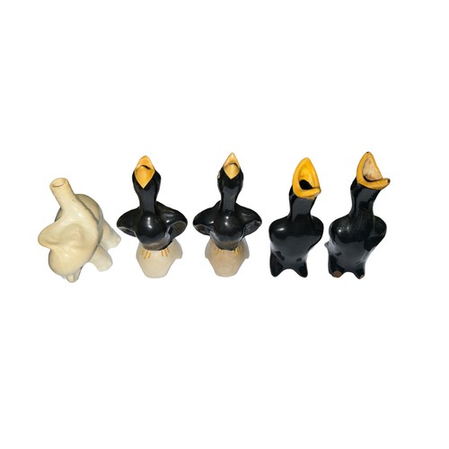 514 - A selection of five ceramic pie funnels, to include; four black bird funnels (two stamped Made in En... 