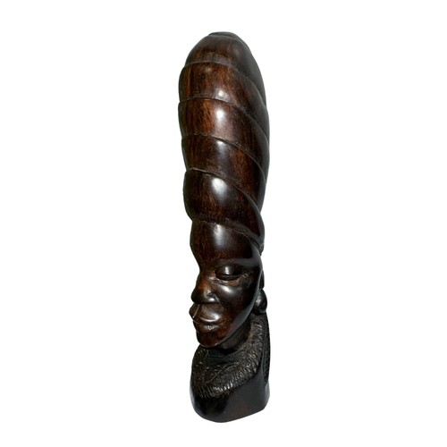 279 - A standing African carved wooden sculpture in the shape of a woman’s head with a phallic design and ... 