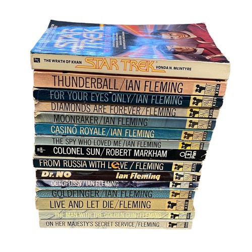 704 - FLEMMING, IAN. ‘James Bond’ A selection of fourteen James Bond Pan Books to include; Casino Royale, ... 