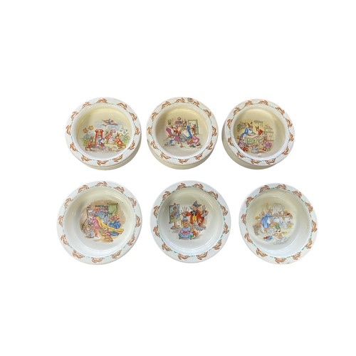 112 - Royal Doulton Bunnykins Childs Dinner Service to include two-handled cups (4), mugs (4, 3 are damage... 