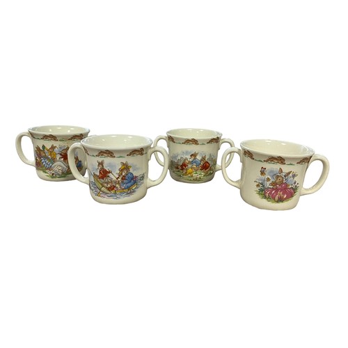 112 - Royal Doulton Bunnykins Childs Dinner Service to include two-handled cups (4), mugs (4, 3 are damage... 