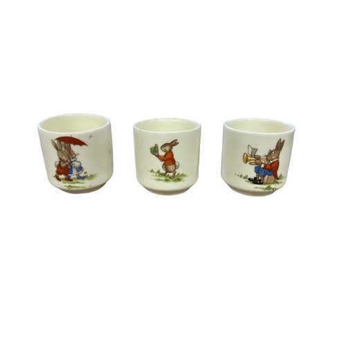 112 - Royal Doulton Bunnykins Childs Dinner Service to include two-handled cups (4), mugs (4, 3 are damage... 