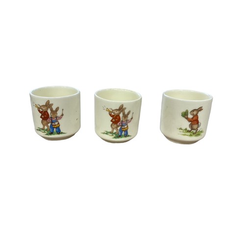 112 - Royal Doulton Bunnykins Childs Dinner Service to include two-handled cups (4), mugs (4, 3 are damage... 