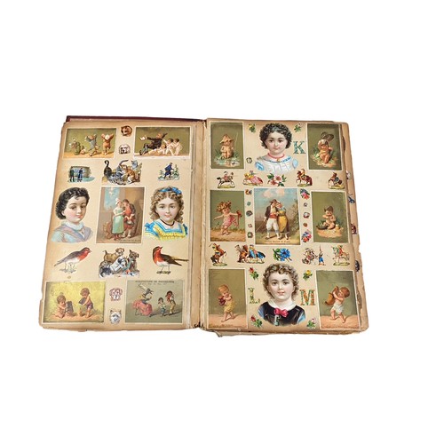 728 - Victorian scrap book with 70+ pages of colour cut-outs, greetings cards etc, significant foxing, fro... 