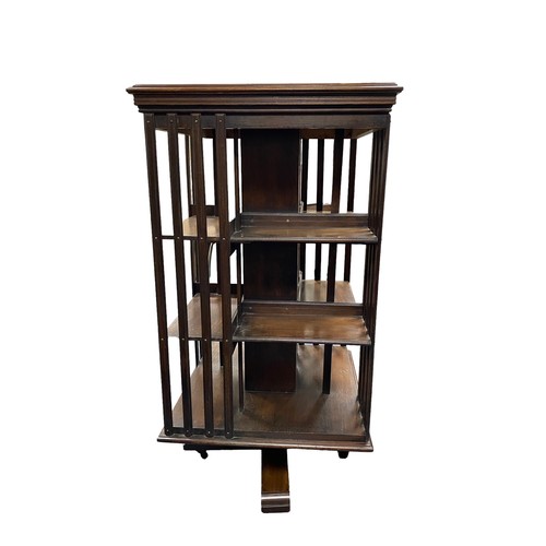 49 - Large mahogany revolving bookcase, height 122cm, top 62cm square.