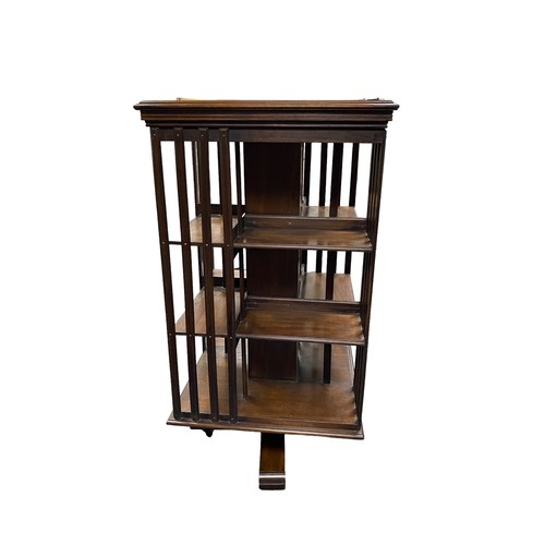 49 - Large mahogany revolving bookcase, height 122cm, top 62cm square.