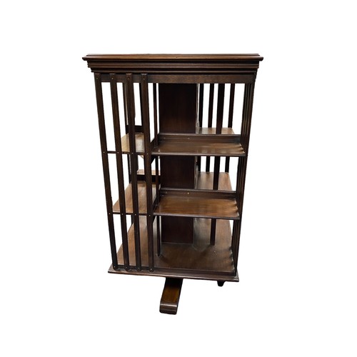 49 - Large mahogany revolving bookcase, height 122cm, top 62cm square.